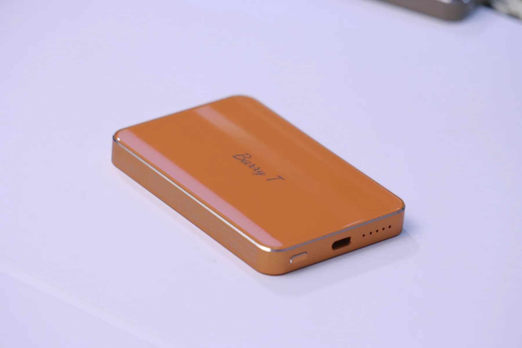 SZA POWER orange compact power bank with USB-C port and indicator lights